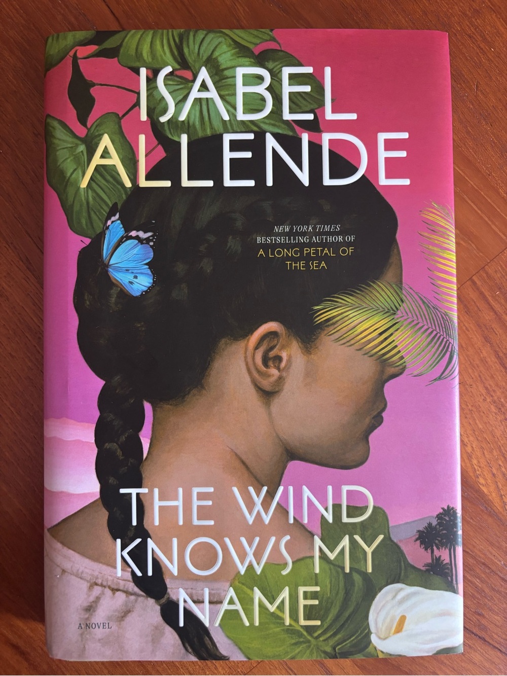 The Wind Knows My Name - Pink Hardcover Book - signed by author.